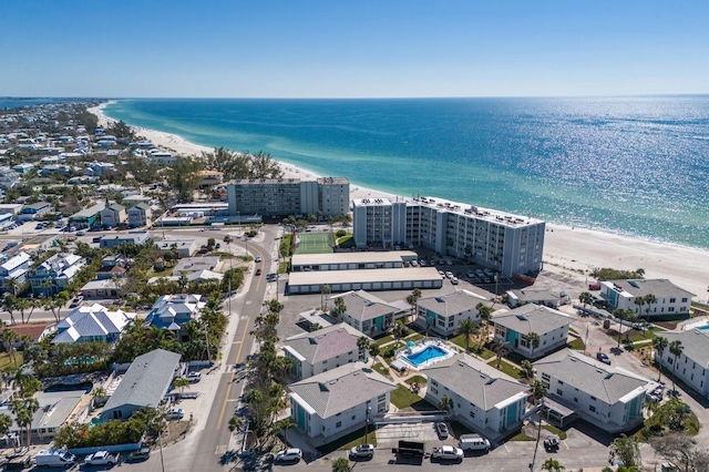 bird's eye view with a water view and a beach view