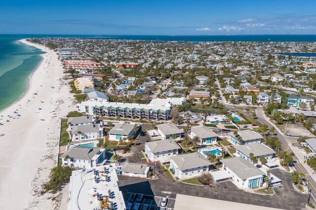 drone / aerial view with a water view and a view of the beach