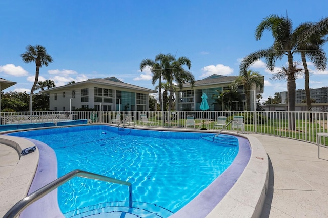 community pool featuring fence