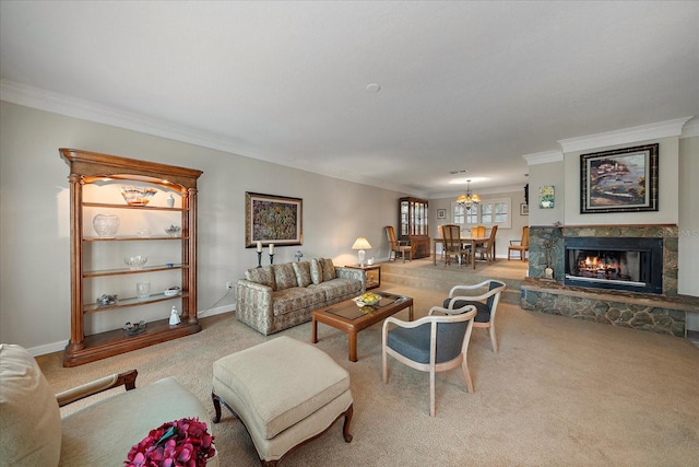 living area featuring crown molding, a fireplace, carpet flooring, baseboards, and an inviting chandelier