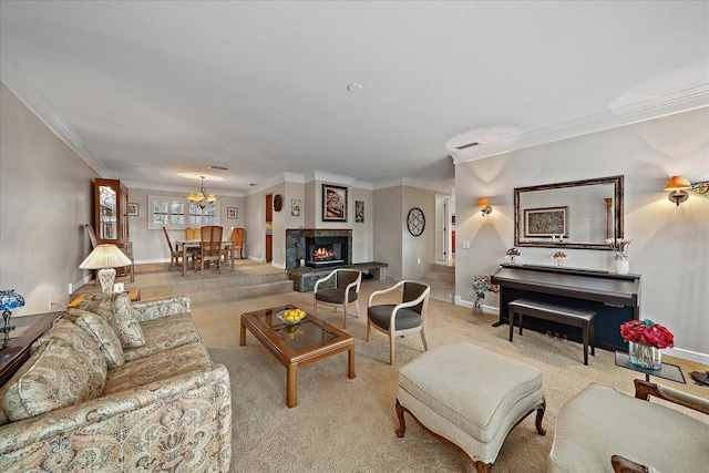 living area featuring baseboards, a lit fireplace, carpet, and crown molding