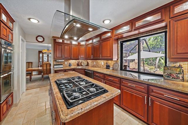 kitchen featuring exhaust hood, stone tile flooring, double oven, backsplash, and black gas stovetop