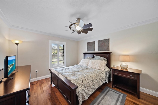 bedroom with dark wood-style floors, baseboards, a ceiling fan, and crown molding