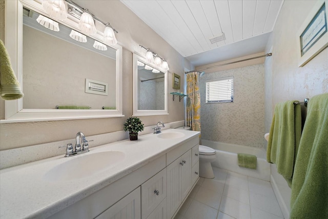 bathroom featuring tile patterned flooring, visible vents, a sink, and toilet