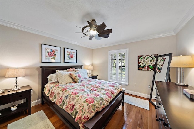 bedroom featuring crown molding, baseboards, ceiling fan, and dark wood-type flooring