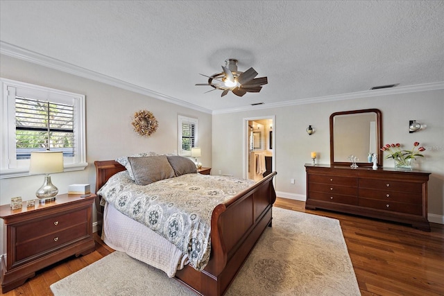 bedroom with a textured ceiling, ornamental molding, and wood finished floors