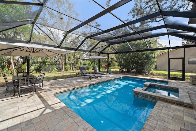 view of pool with outdoor dining space, a pool with connected hot tub, glass enclosure, and a patio