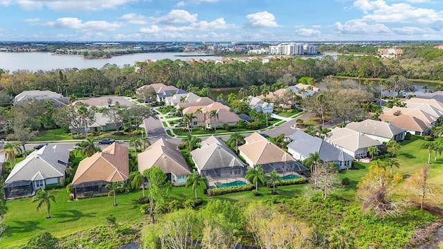 bird's eye view with a water view and a residential view