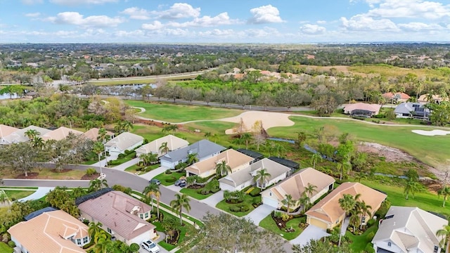 bird's eye view featuring view of golf course and a residential view