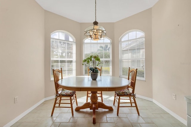 dining room featuring baseboards