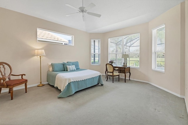 bedroom with multiple windows, carpet flooring, and baseboards