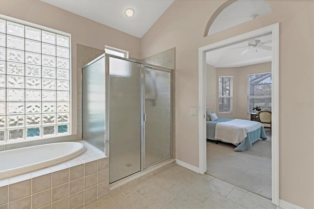 bathroom with vaulted ceiling, plenty of natural light, ensuite bath, and a shower stall