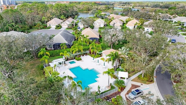 drone / aerial view with a residential view and a water view