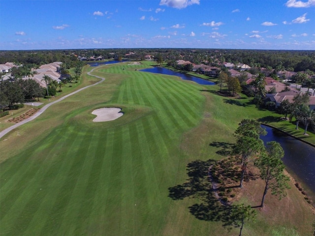 aerial view featuring golf course view and a water view