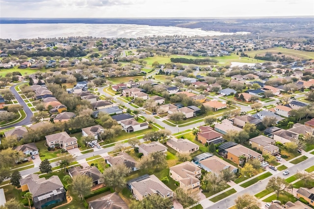 bird's eye view featuring a water view and a residential view