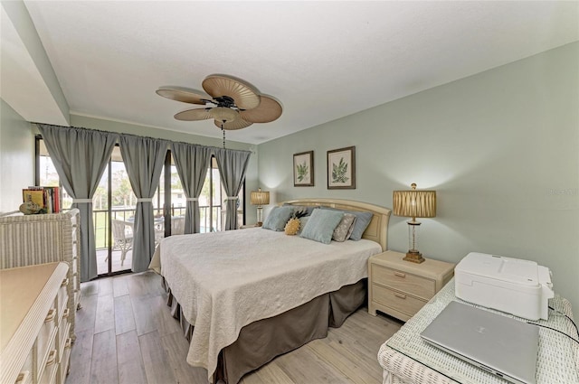 bedroom with access to exterior, light wood-type flooring, and ceiling fan