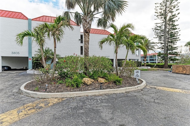 view of property with a parking lot