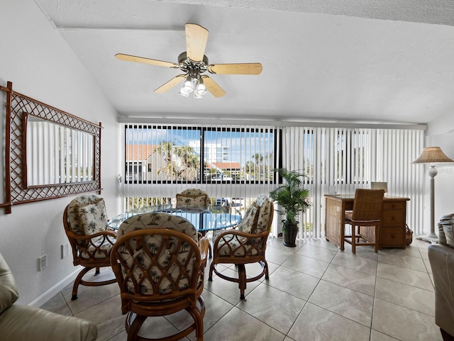 4621 Gulf Of Mexico Dr Unit 19B, Longboat Key, FL 34228 - dining room with light tile patterned floors, a ceiling fan, and vaulted ceiling