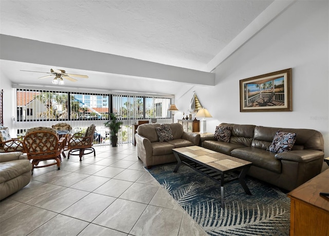 4621 Gulf Of Mexico Dr Unit 19B, Longboat Key, FL 34228 - living room with ceiling fan, vaulted ceiling, light tile patterned floors, and a textured ceiling