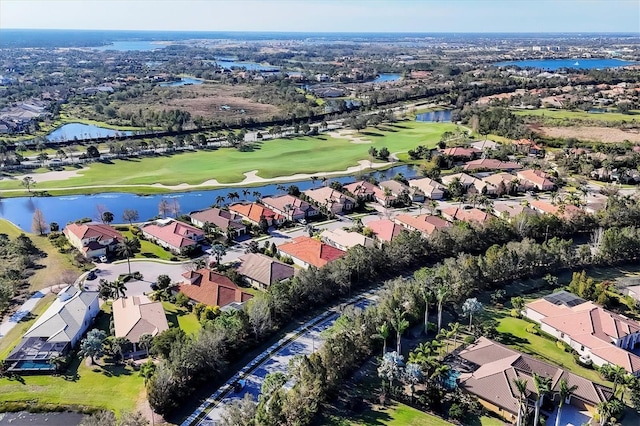 birds eye view of property featuring a water view, a residential view, and golf course view