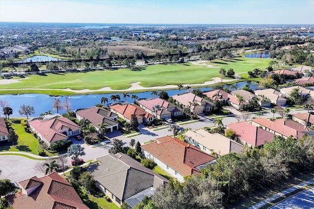 aerial view featuring a residential view, a water view, and golf course view