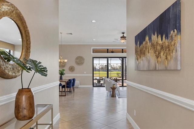 corridor with recessed lighting, visible vents, a chandelier, baseboards, and tile patterned floors