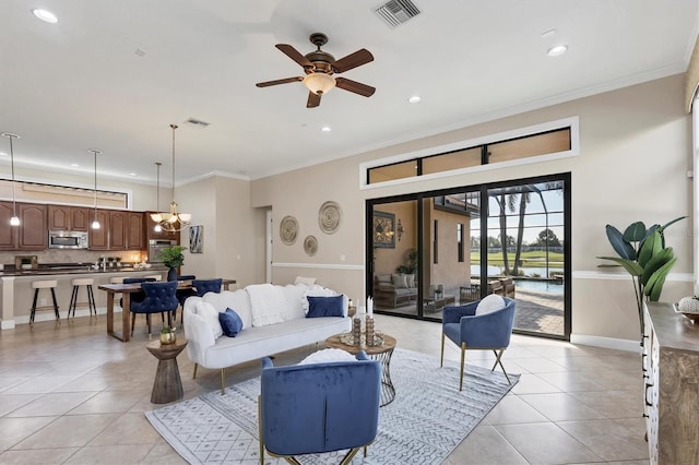 living room with light tile patterned flooring, visible vents, and crown molding