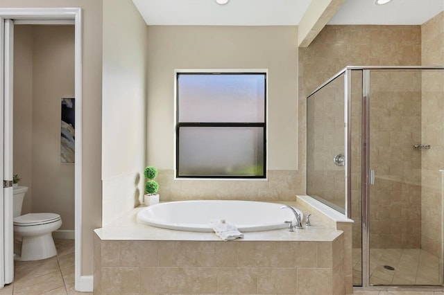 bathroom featuring a bath, tile patterned flooring, a shower stall, and toilet