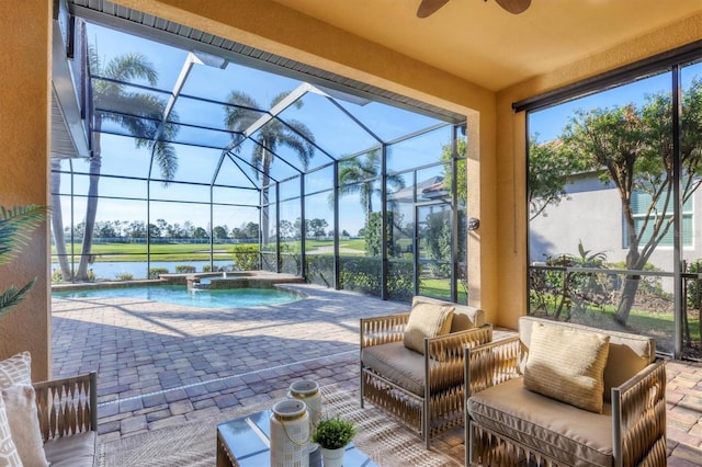 view of patio featuring a lanai, a water view, a pool with connected hot tub, and outdoor lounge area