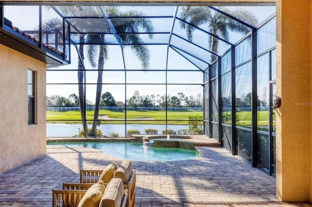 view of pool featuring a lanai, a water view, a pool with connected hot tub, and a patio area