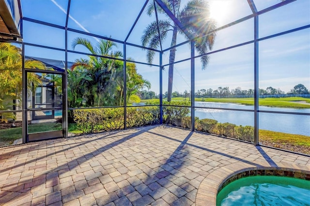 unfurnished sunroom with a water view