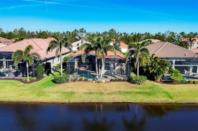 drone / aerial view with a water view and a residential view