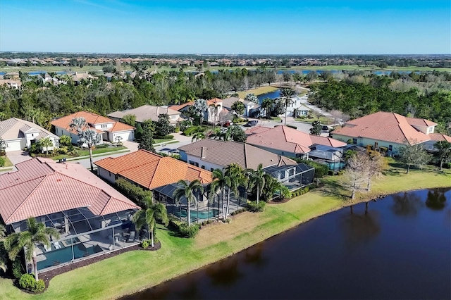 aerial view with a water view and a residential view