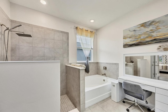 ensuite bathroom featuring ensuite bath, tile patterned flooring, a walk in shower, and a bath