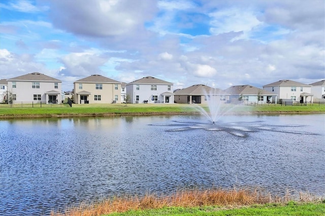 water view with a residential view and fence