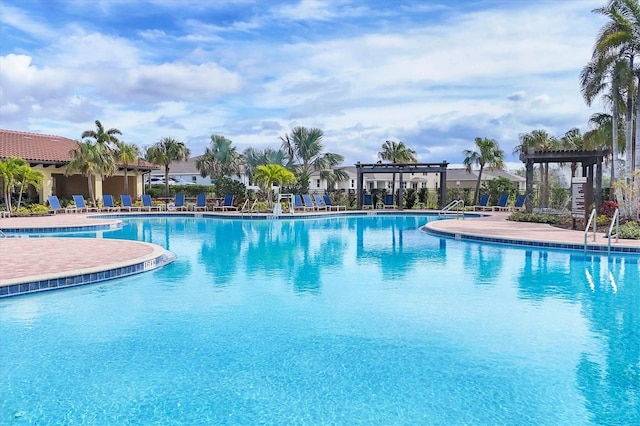 community pool with a pergola