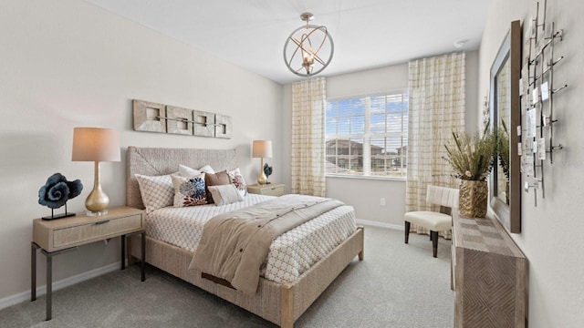 bedroom featuring light carpet and baseboards