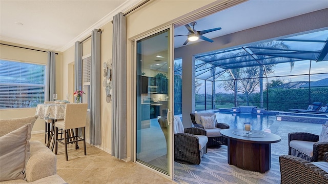 sunroom / solarium with a ceiling fan