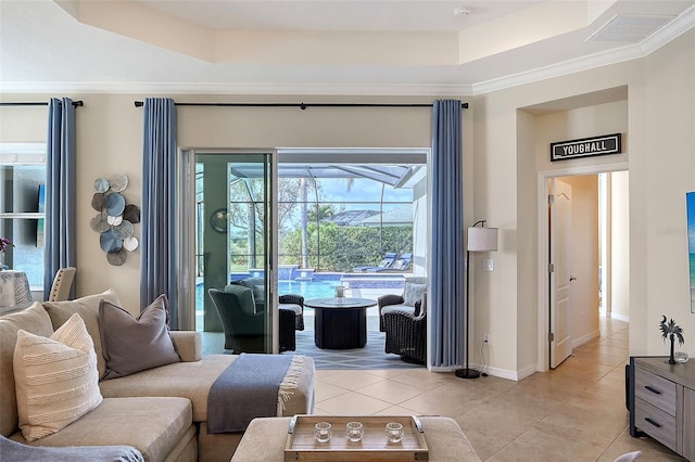 living room featuring baseboards, visible vents, a raised ceiling, and light tile patterned flooring