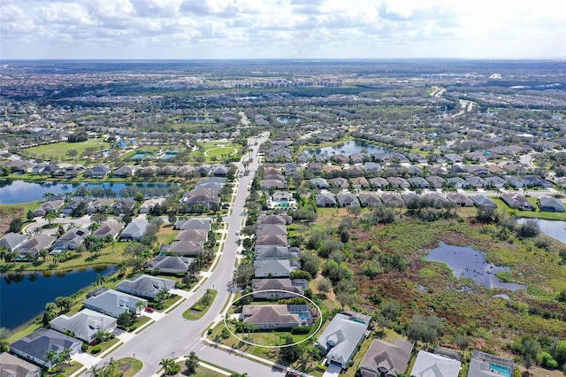 aerial view featuring a water view and a residential view