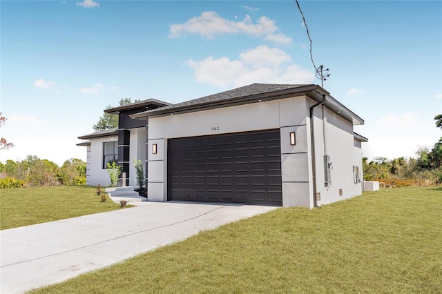 view of front of property with a garage, driveway, a front lawn, and stucco siding