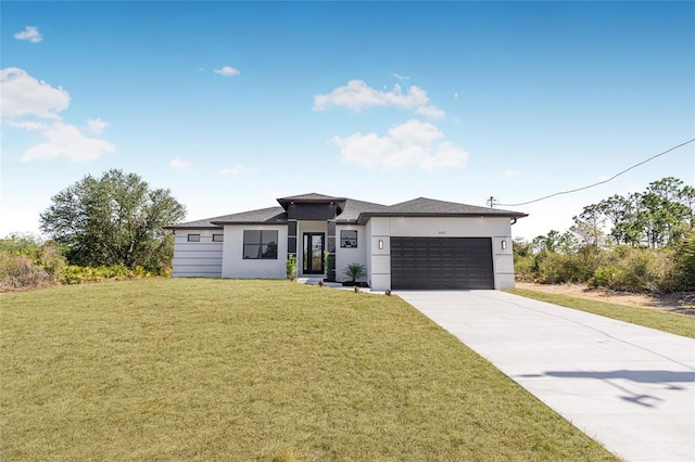 view of front facade with a garage, concrete driveway, a front lawn, and stucco siding