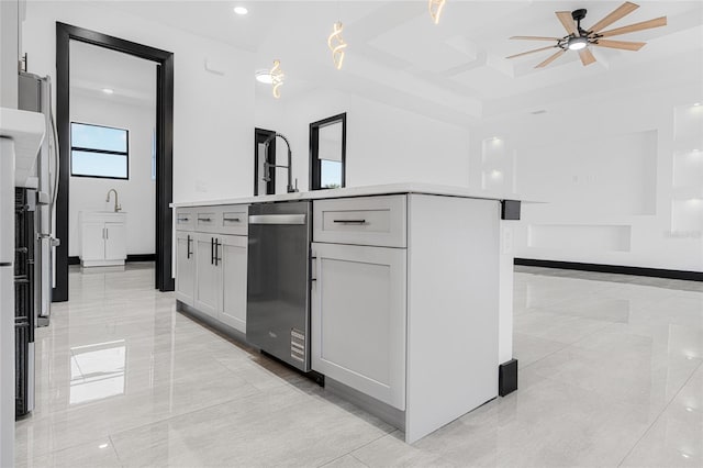 kitchen with light countertops, a kitchen island with sink, white cabinets, and dishwasher