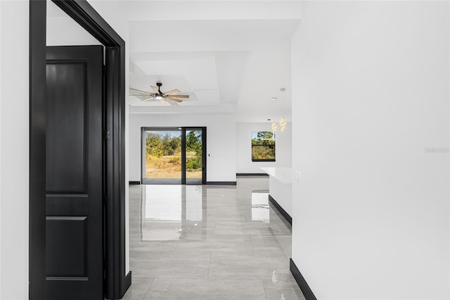 hallway featuring baseboards