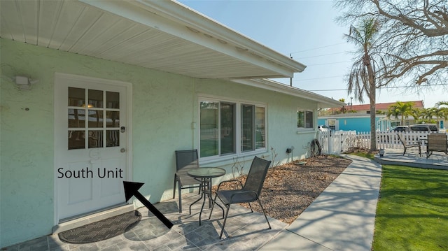 view of patio featuring fence