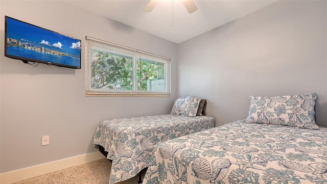 bedroom with lofted ceiling, baseboards, a ceiling fan, and speckled floor