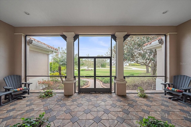 sunroom featuring ornate columns