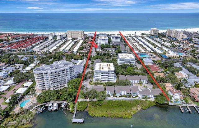 drone / aerial view featuring a water view and a city view