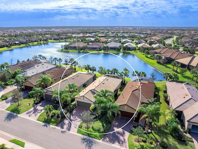 bird's eye view featuring a water view and a residential view