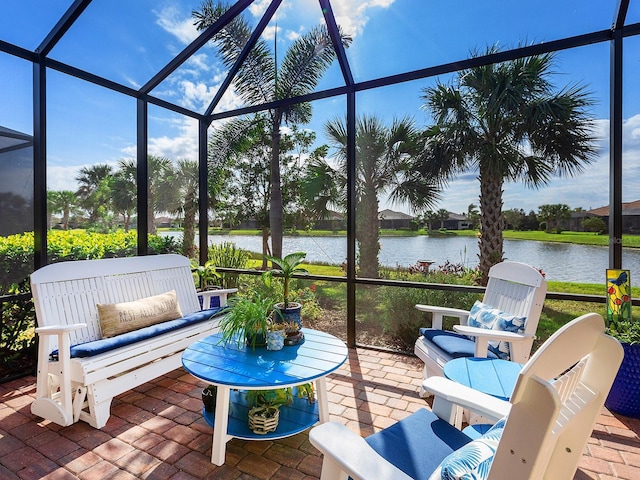 sunroom / solarium with a water view and plenty of natural light